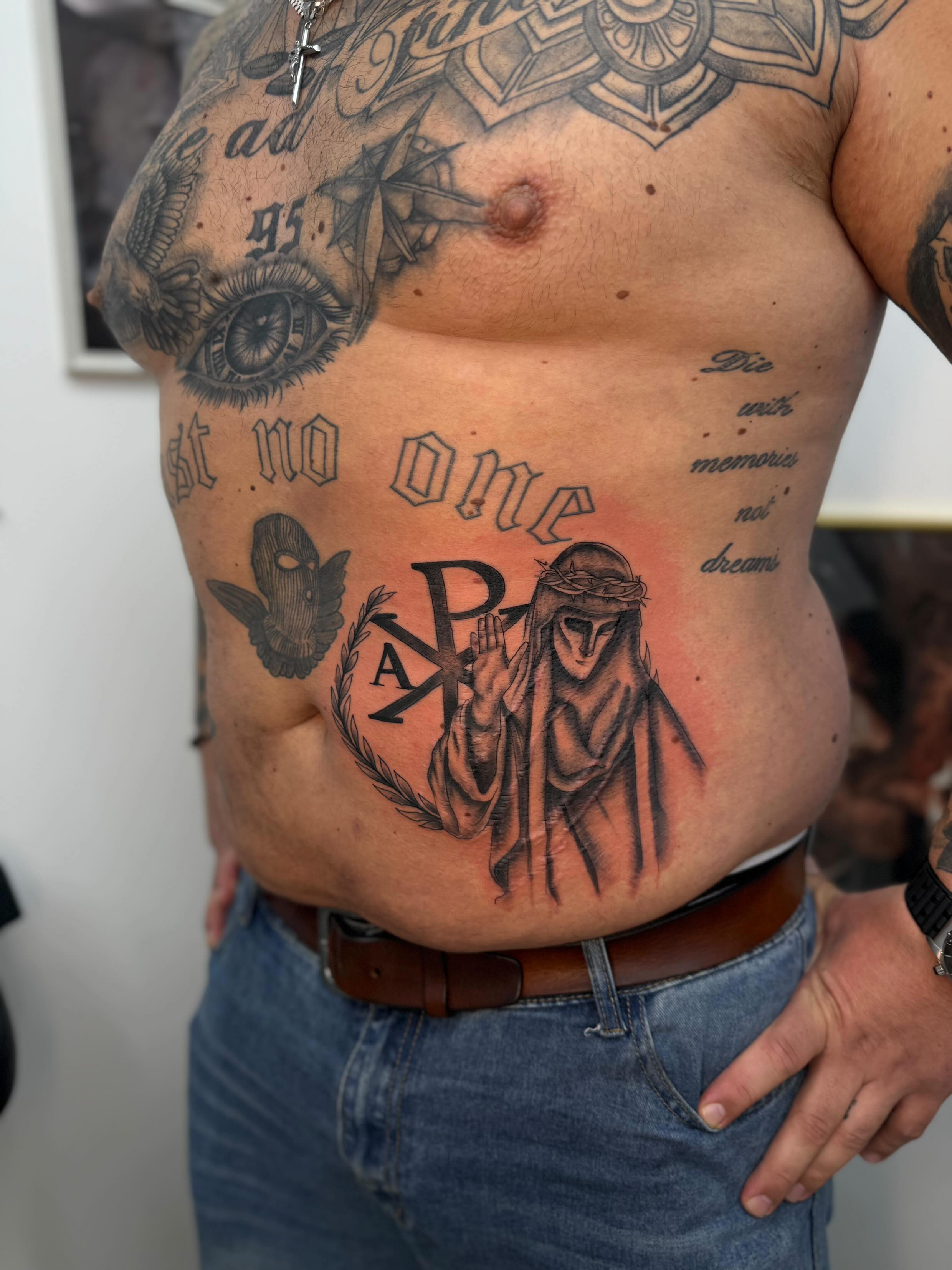 Religiöses Chi-Rho Tattoo